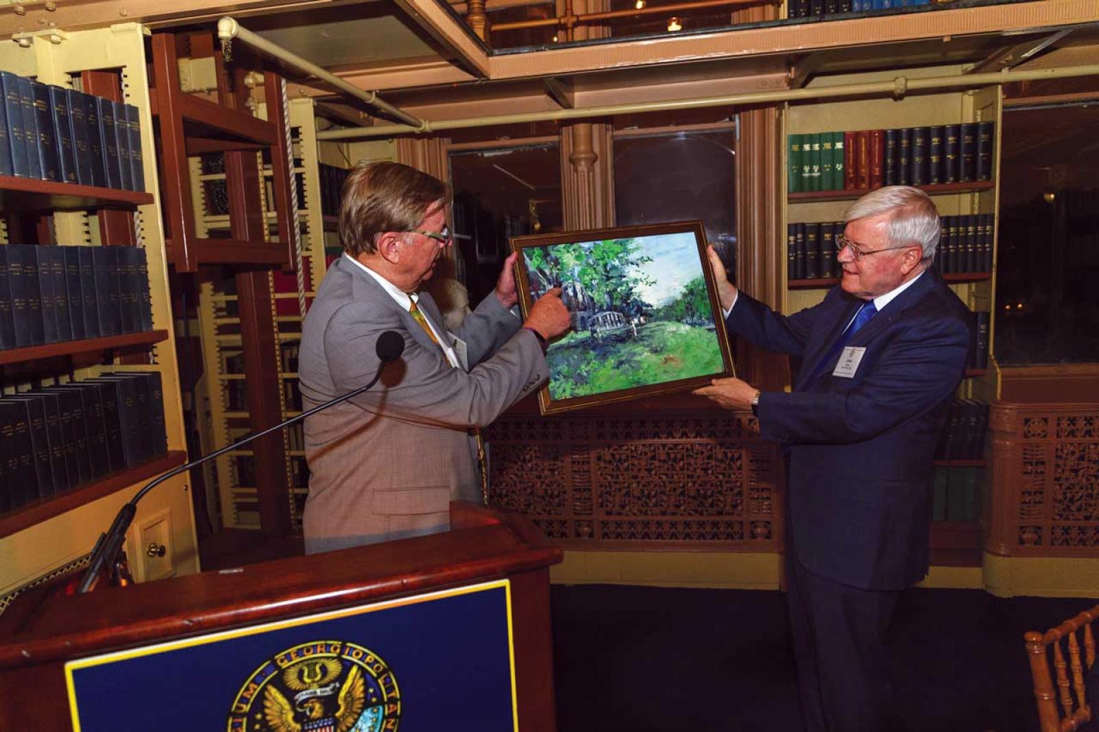 At a September 2018 event in Riggs Library, the family, friends, and colleagues of Charles A. Read, M.D., celebrated his investiture as the inaugural recipient of the Allan J. Goody, M.D., Endowed Professorship in Medical Education. The painting shows Dr. Goody’s memorial bench and Yoshino cherry tree on the School of Medicine campus.