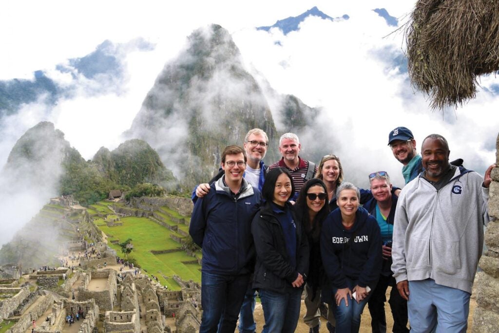 Faculty and staff gather atop Machu Picchu in a unique educational and bonding experience made possible through an anonymous gift.