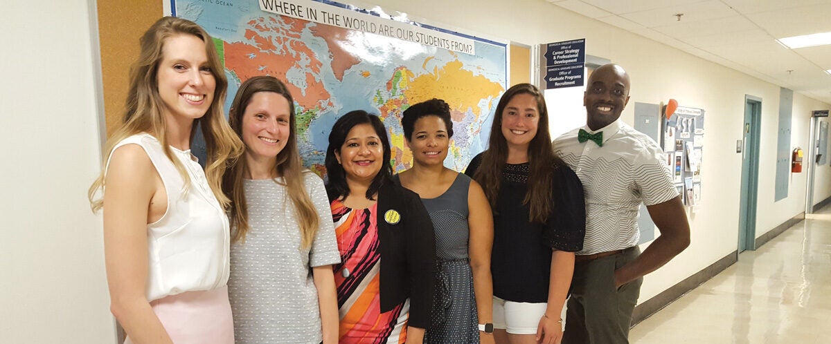 rior to the pandemic, McKinney (far right) invited Dr. Poorva Dharkar (fourth from right) to campus to meet with Georgetown’s Women in Science & Education student group leaders. At the time Dharkar was president of the Association for Women in Science, Bethesda Chapter. She and the students discussed ways to support gender equity in science.