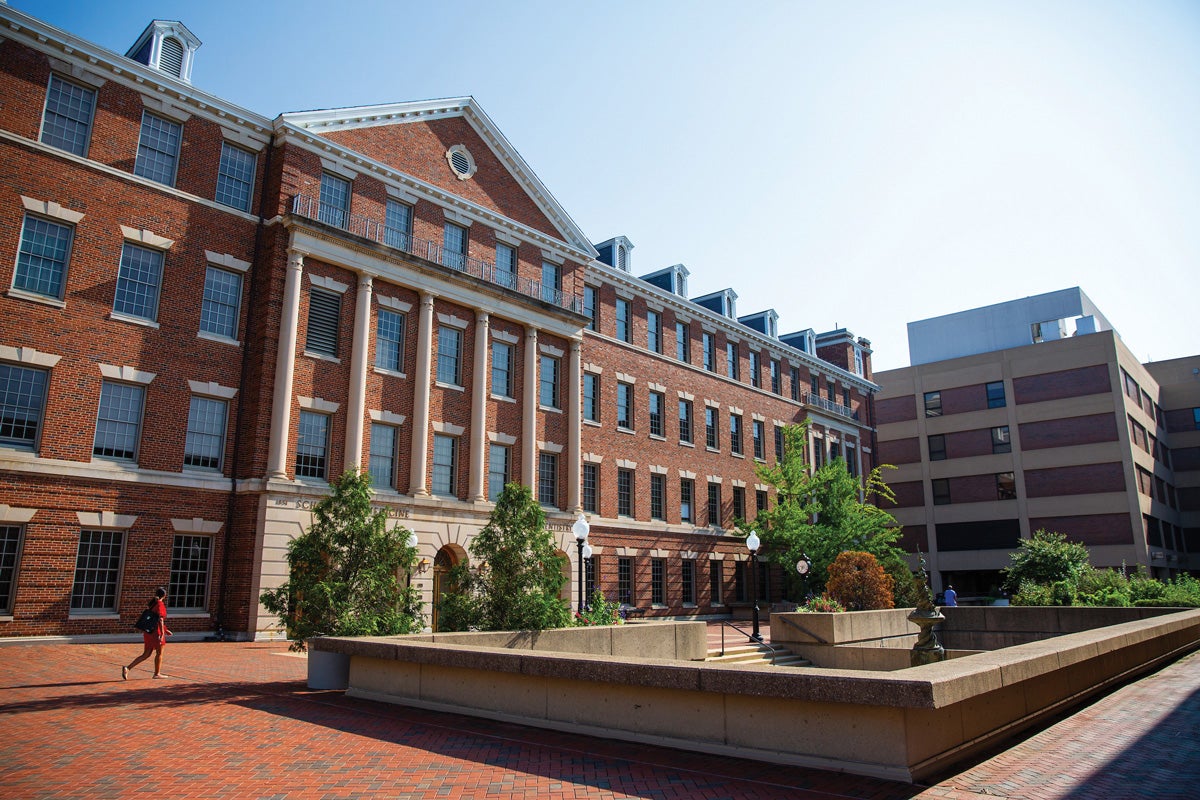 a building with pillars on a university campus