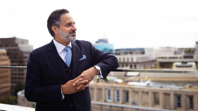 Eduardo M. Peñalver looking out at the dc city