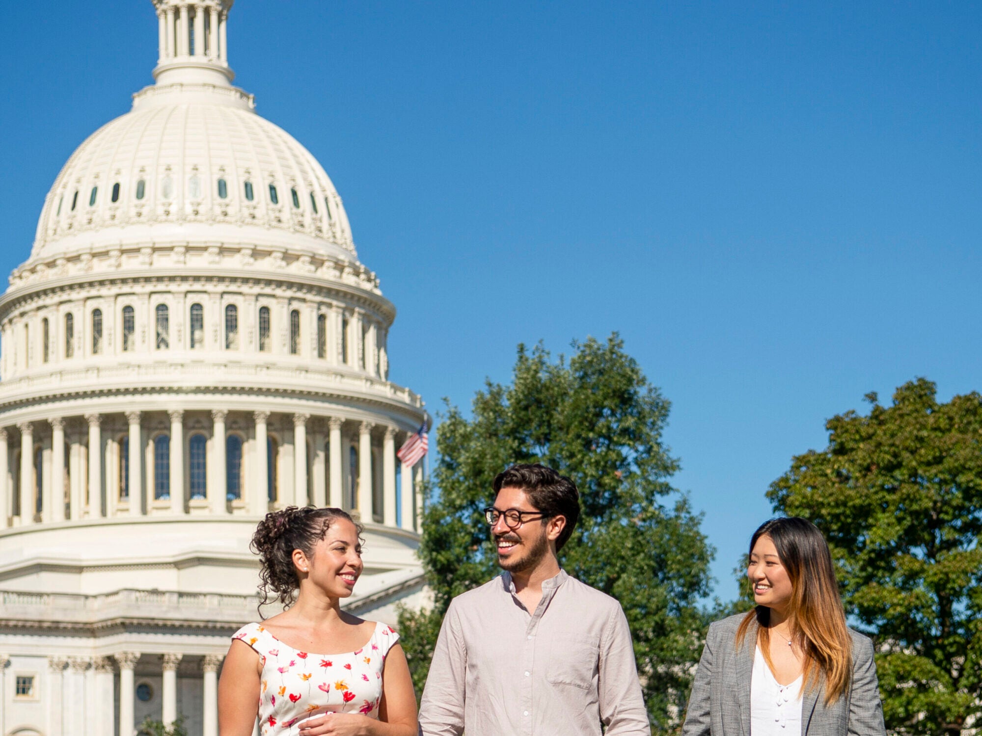 students walking in front of capitol building