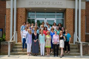 Johnson (center, in a white and blue blouse) and Ellen Eggland (top left, with a blue blouse and white pants) attend their 50th Reunion celebrations in 2019 with the NHS Class of 1969.